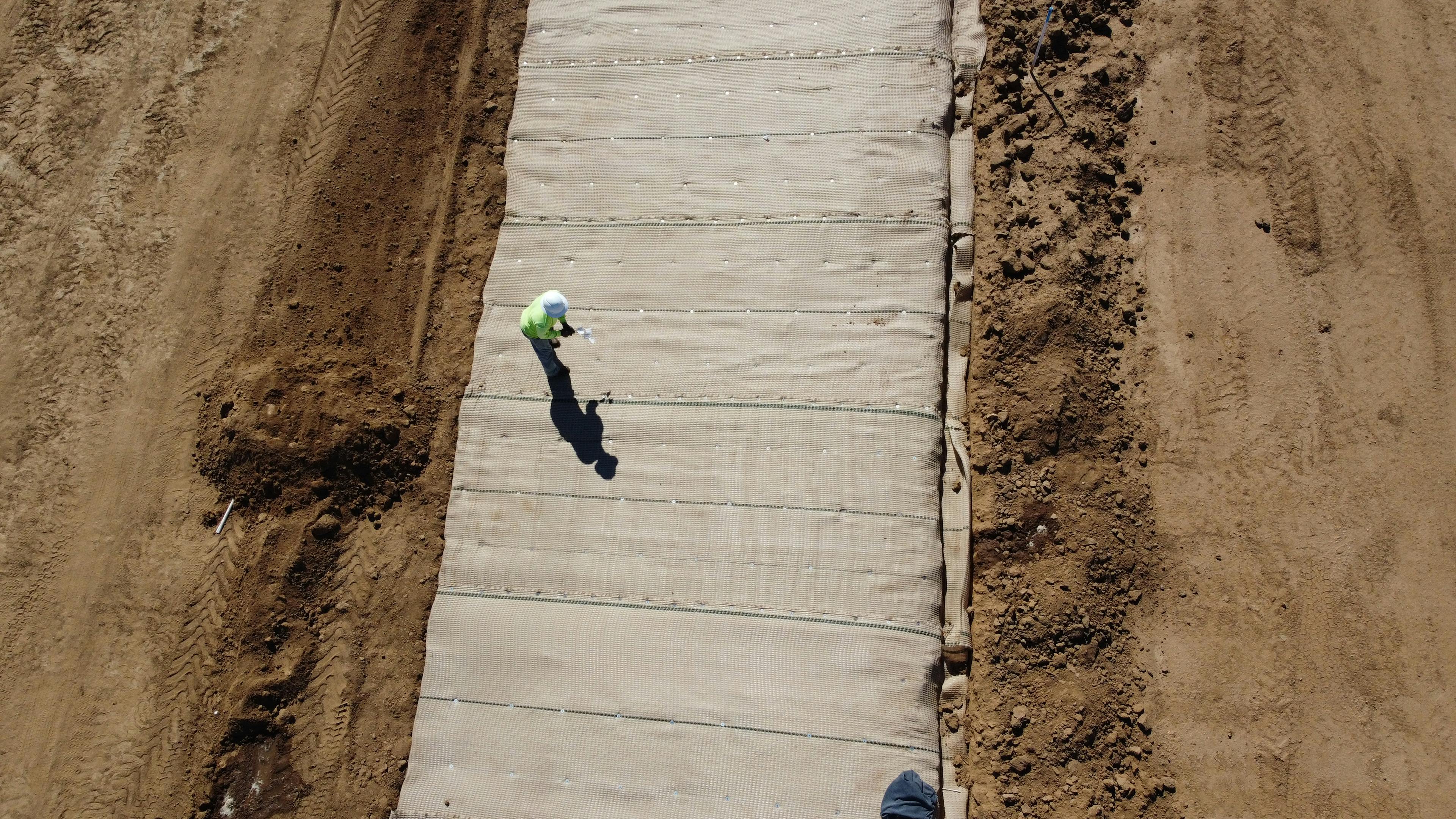 The integration of PROPEX Scourlok® at the slope's base and PROPEX Armormax® above maximizes erosion control in vulnerable areas, ensuring long-term stability and vegetative growth for effective landscape management.