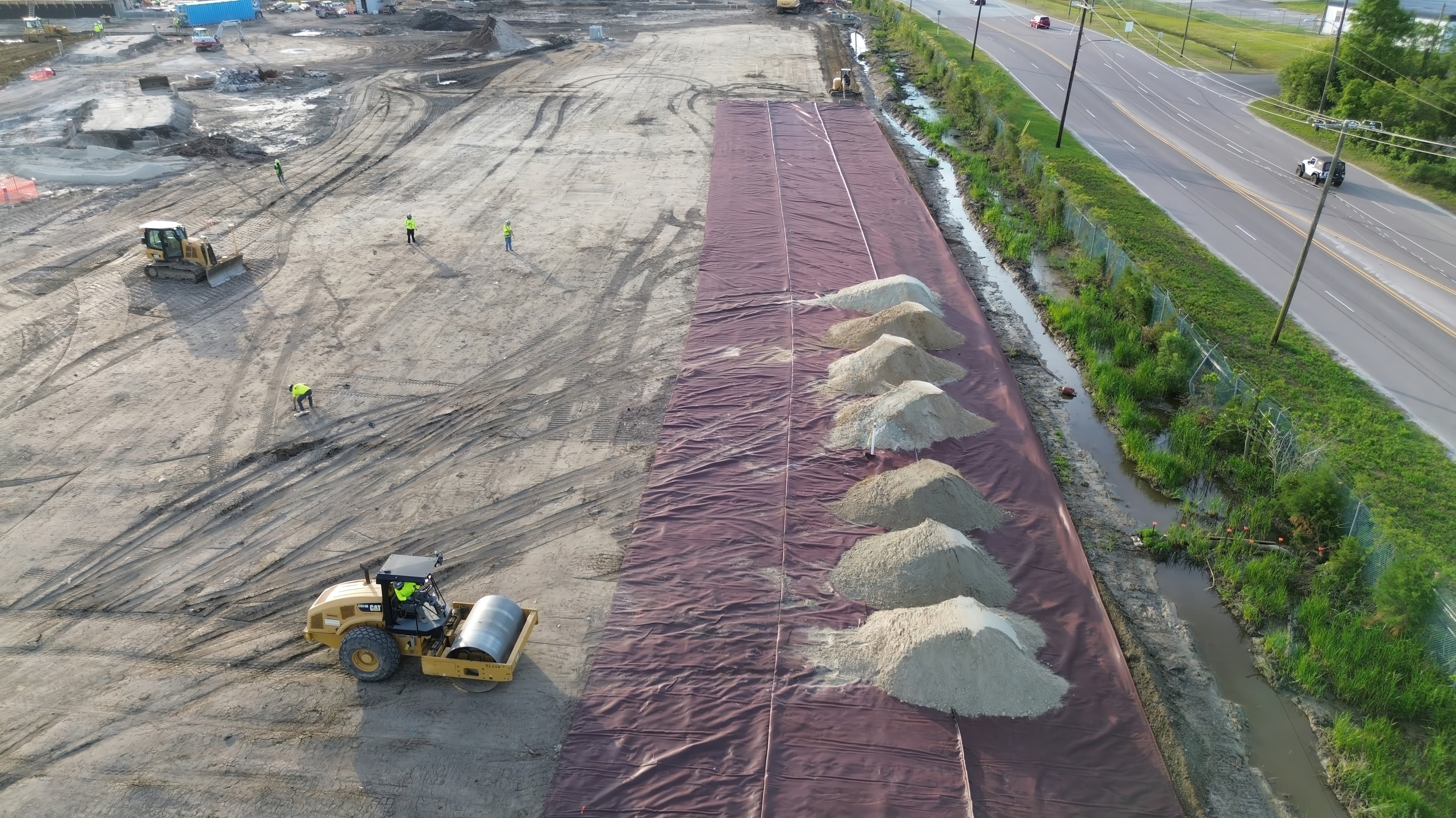 MIRAFI RS380i was installed as part of a multi-layer stabilized platform beneath pavements to reinforce soft subgrades and limit differential settlement.