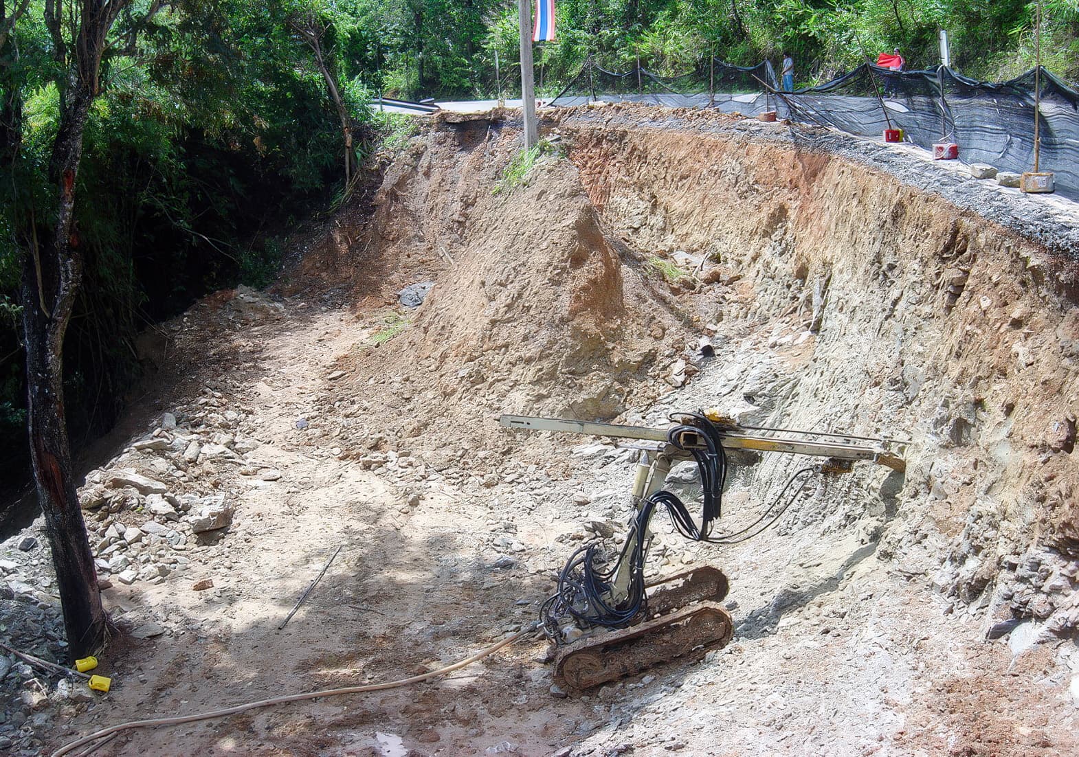 Soil nailing to maintain stability of existing road foundation