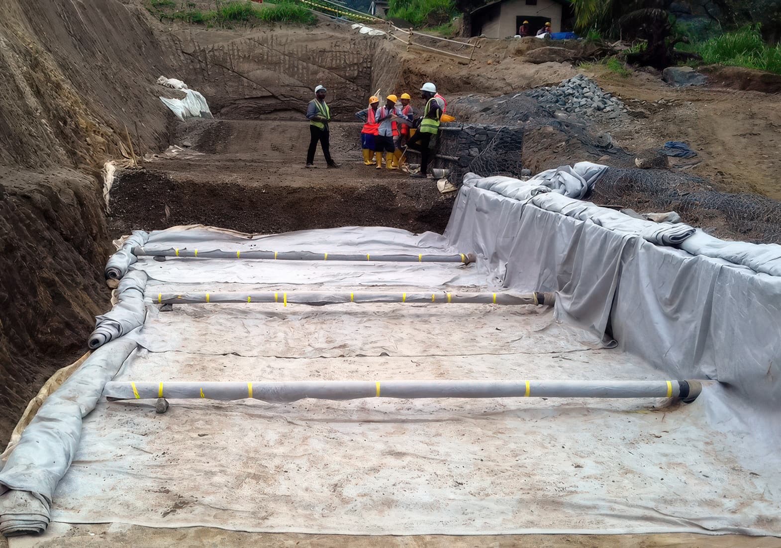 Laying MIRAFI Polyfelt TS geotextile filter for the drainage blankets