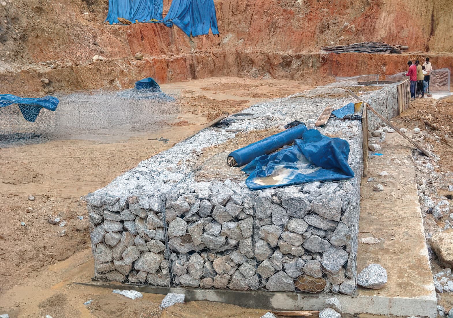 Installing the gabion toe of the reinforced slope