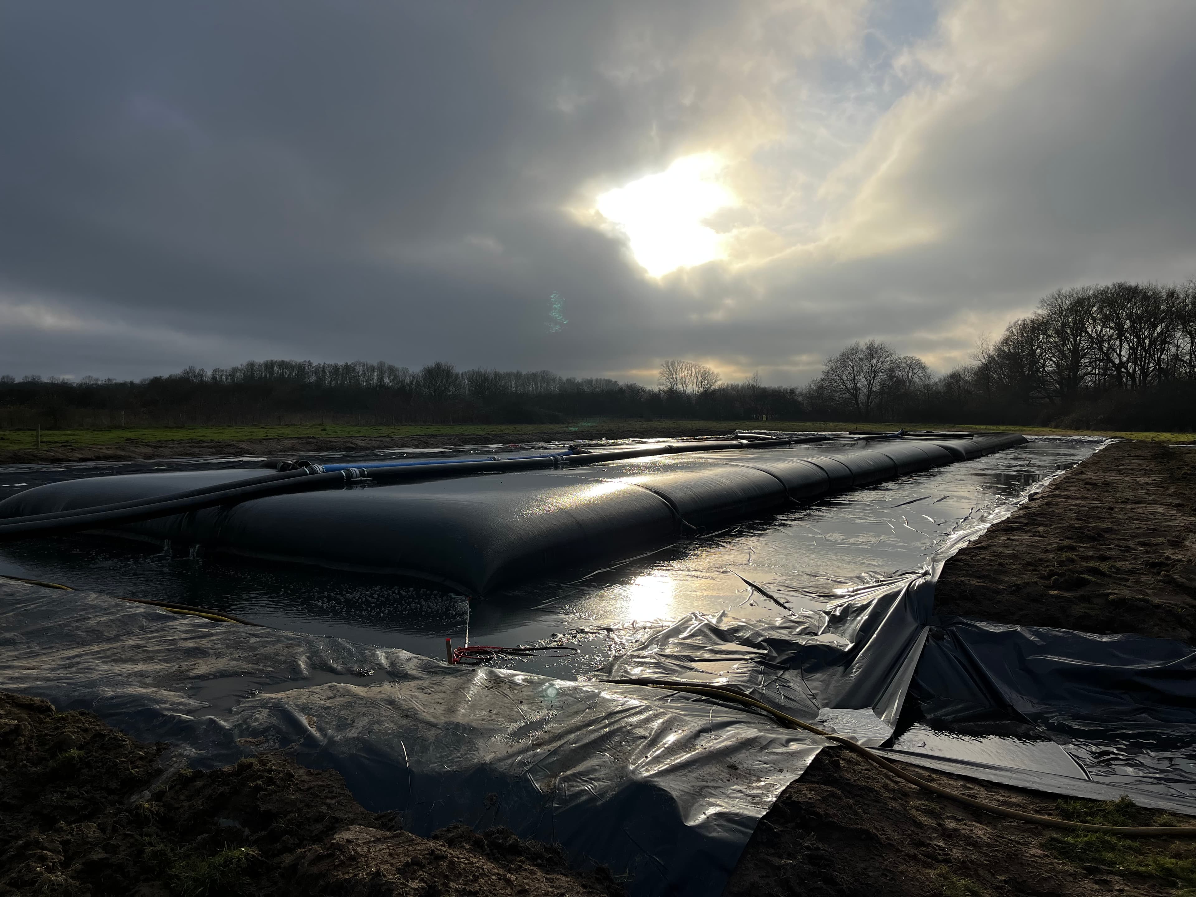 Rapid pond dredging and dewatering under site and time constraints