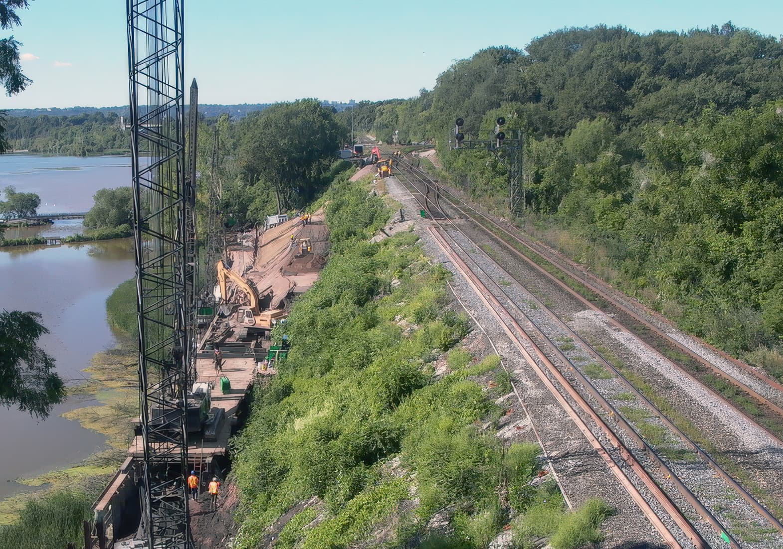 Sheet pile wall installed fill slope construction begins