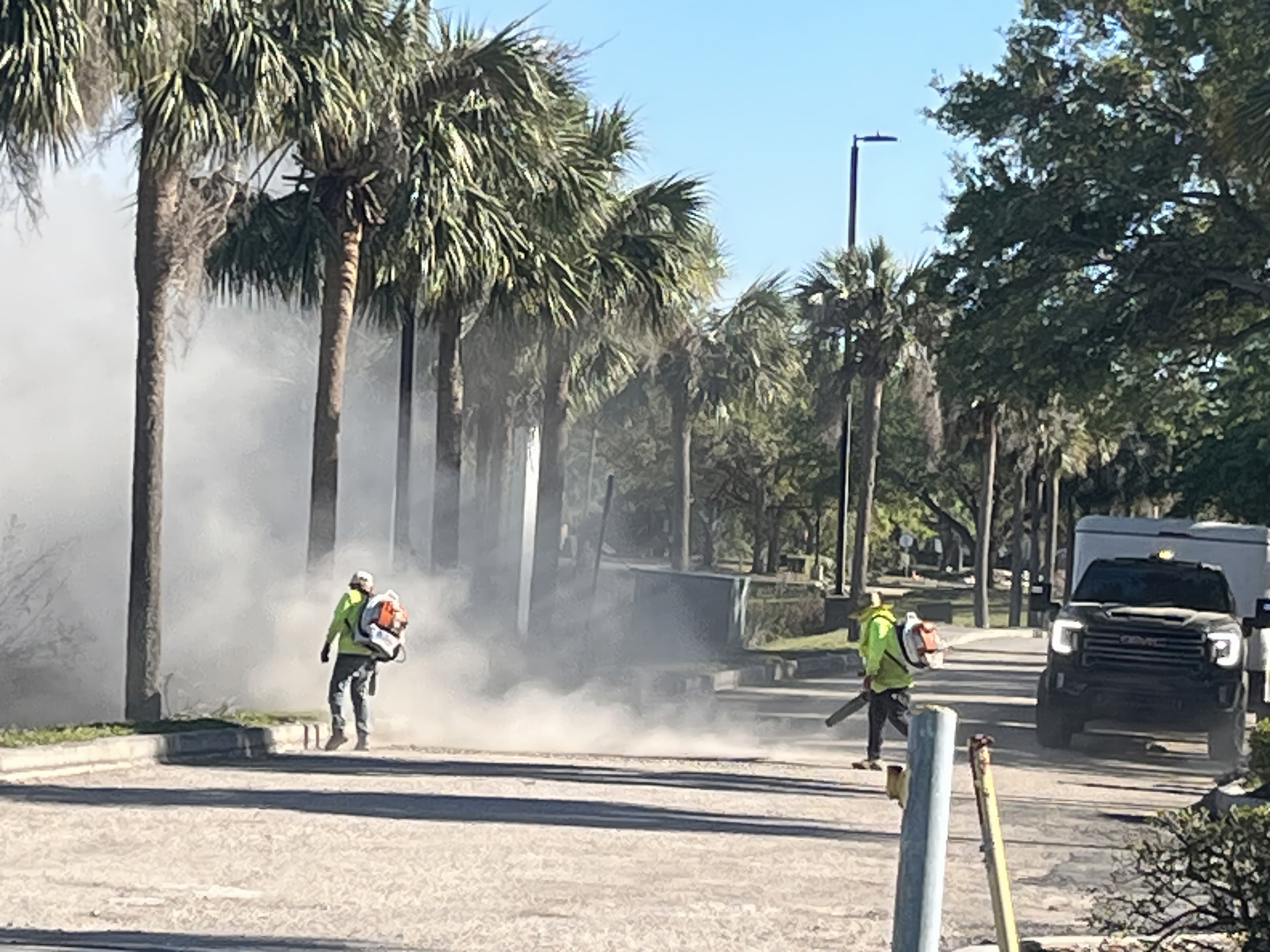 Construction workers clearing dirt and debris