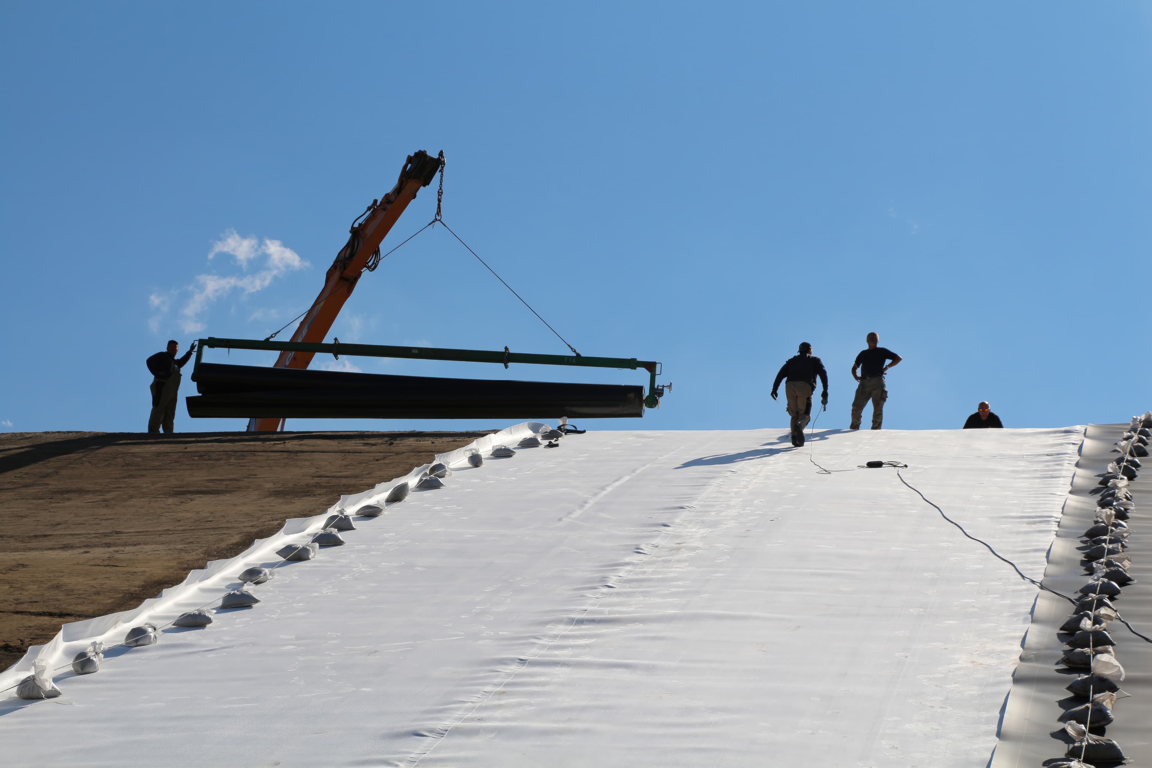 The Gram PTES, at 122,000 m³, had to withstand substantial hydrostatic pressure from the stored water while maintaining impermeability at high operating temperatures.