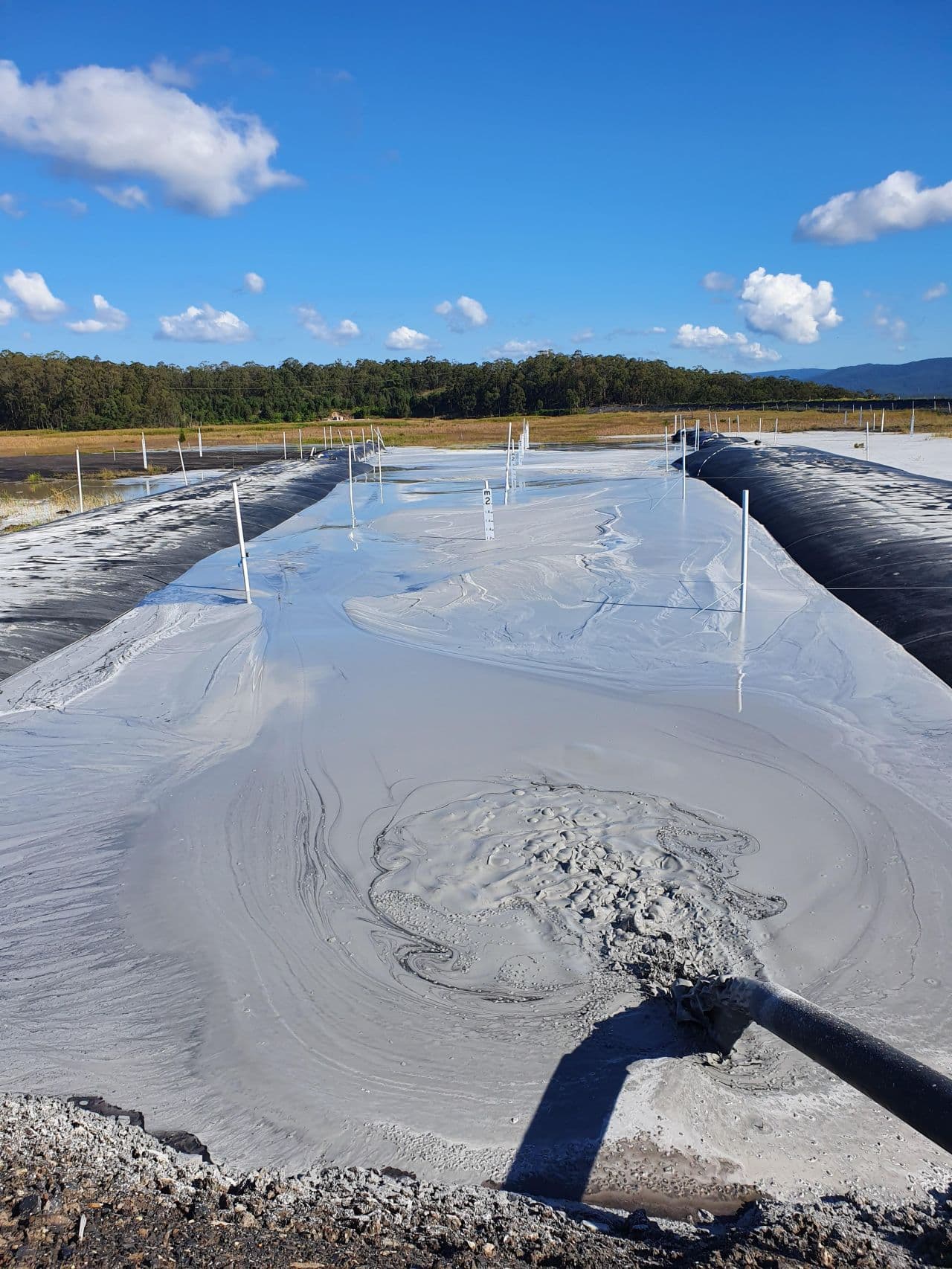 Geotube dewatering fly ash pond