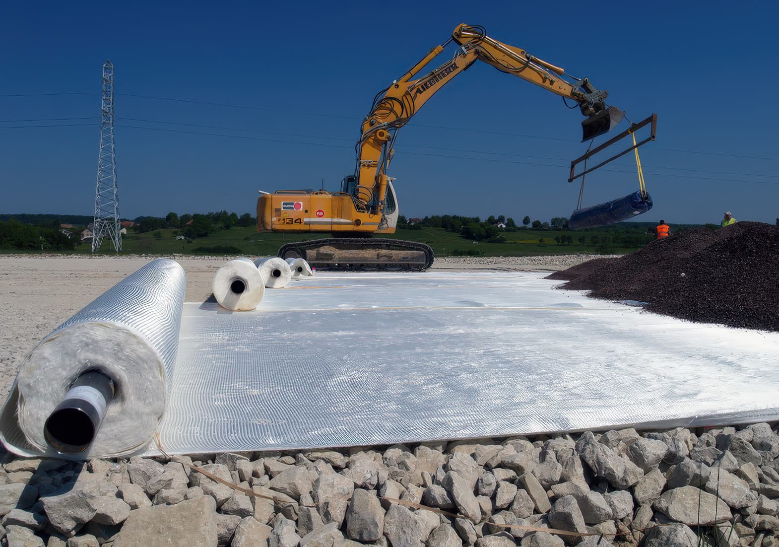 Laying MIRAFI over stone layer