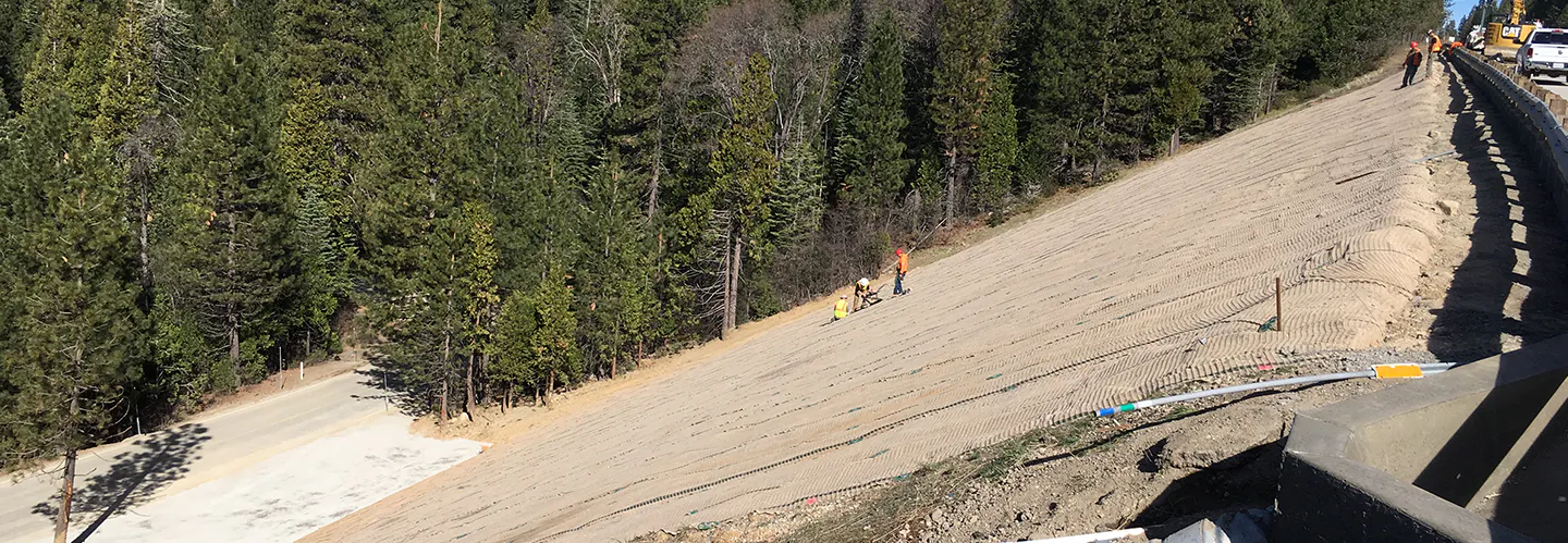 The California Department of Transportation (Caltrans) needed to secure a steep slope between an interstate and a maintenance station. This slope stood at 70 feet (21.3 m) high with gradients ranging from 1.7H:1V to 1H:1V.