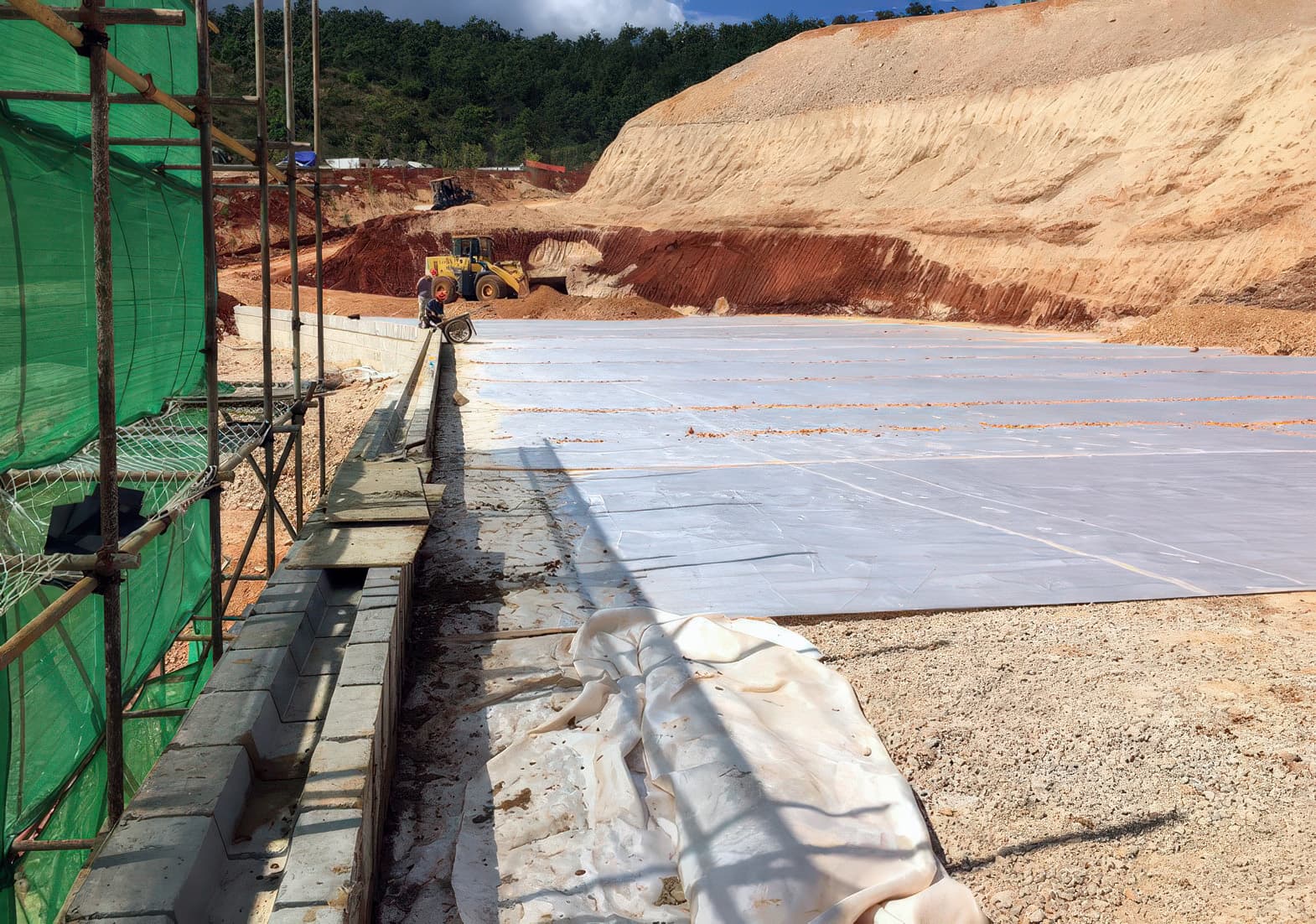 Reinforcement behind segmental block facing