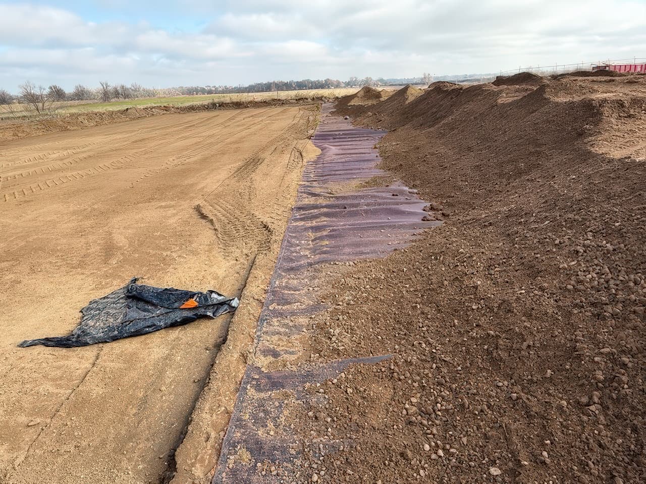 Completed unpaved yard ready for high-capacity lifting equipment, demonstrating the durability and efficiency achieved through geosynthetic reinforcement.