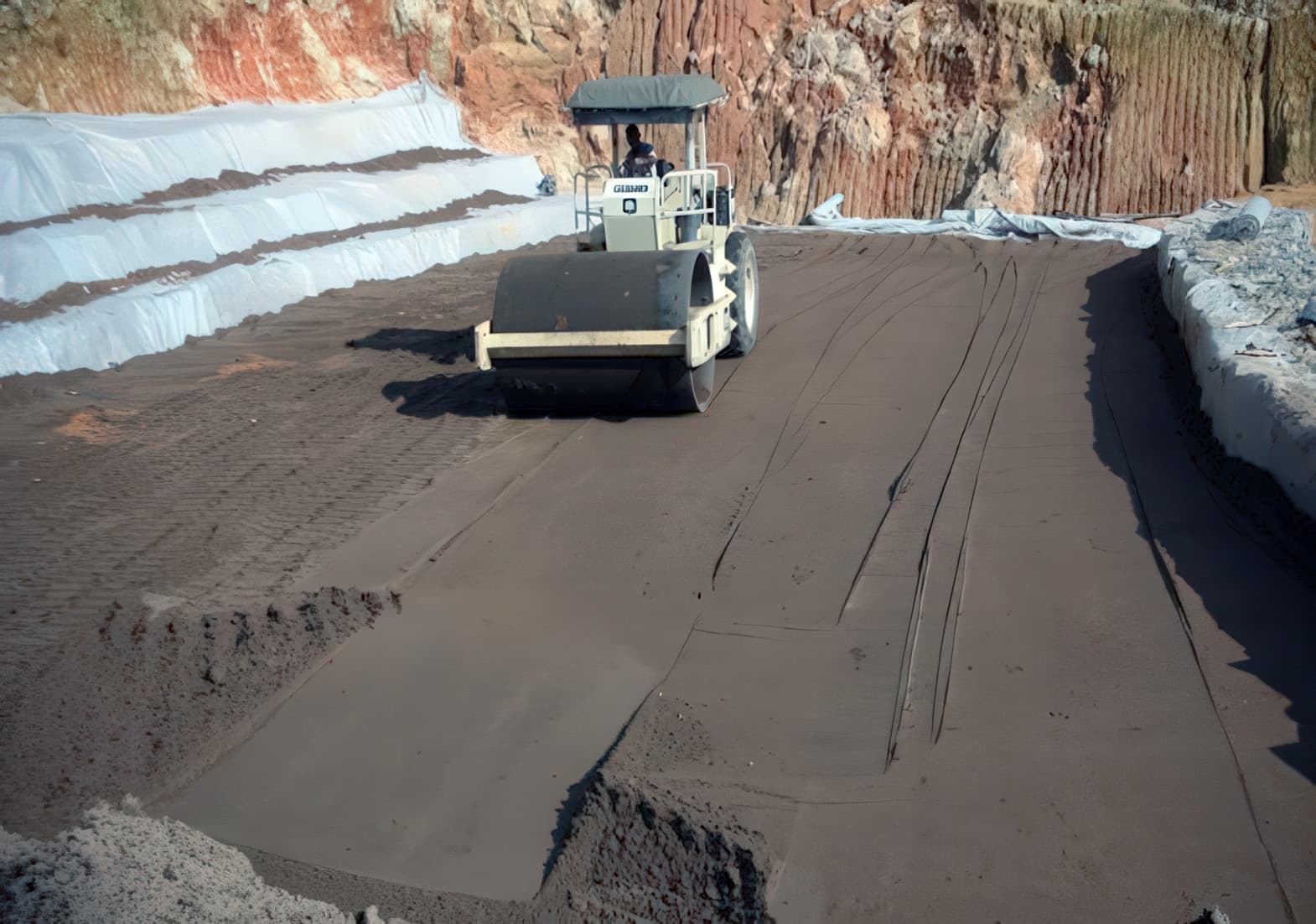 Compacting the reinforced fill