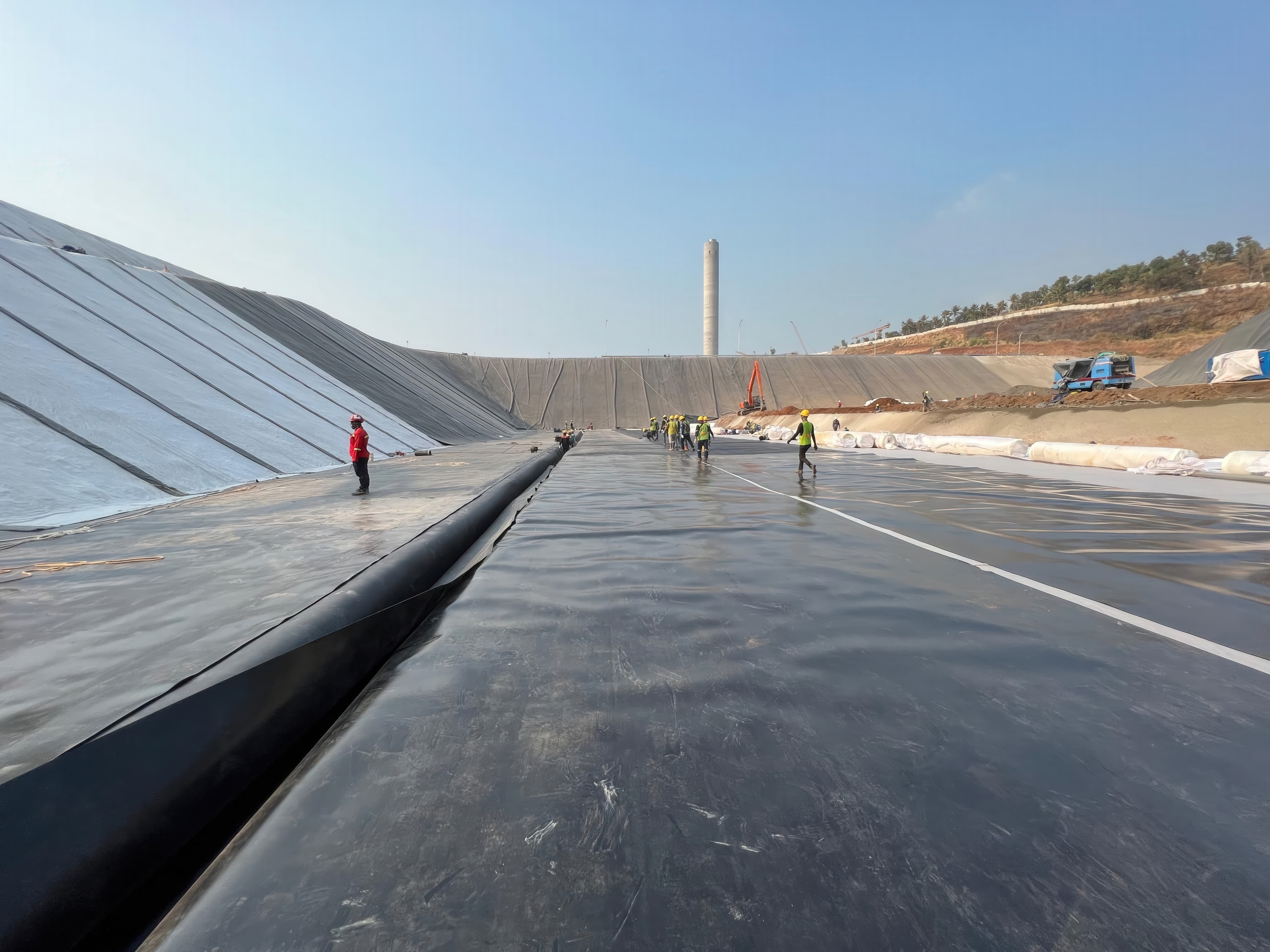 A GSE® HD geomembrane was installed inside an active PLTU ash handling facility, managing weather variability, residual ash conditions, and permitting constraints while maintaining QA/QC standards throughout construction.