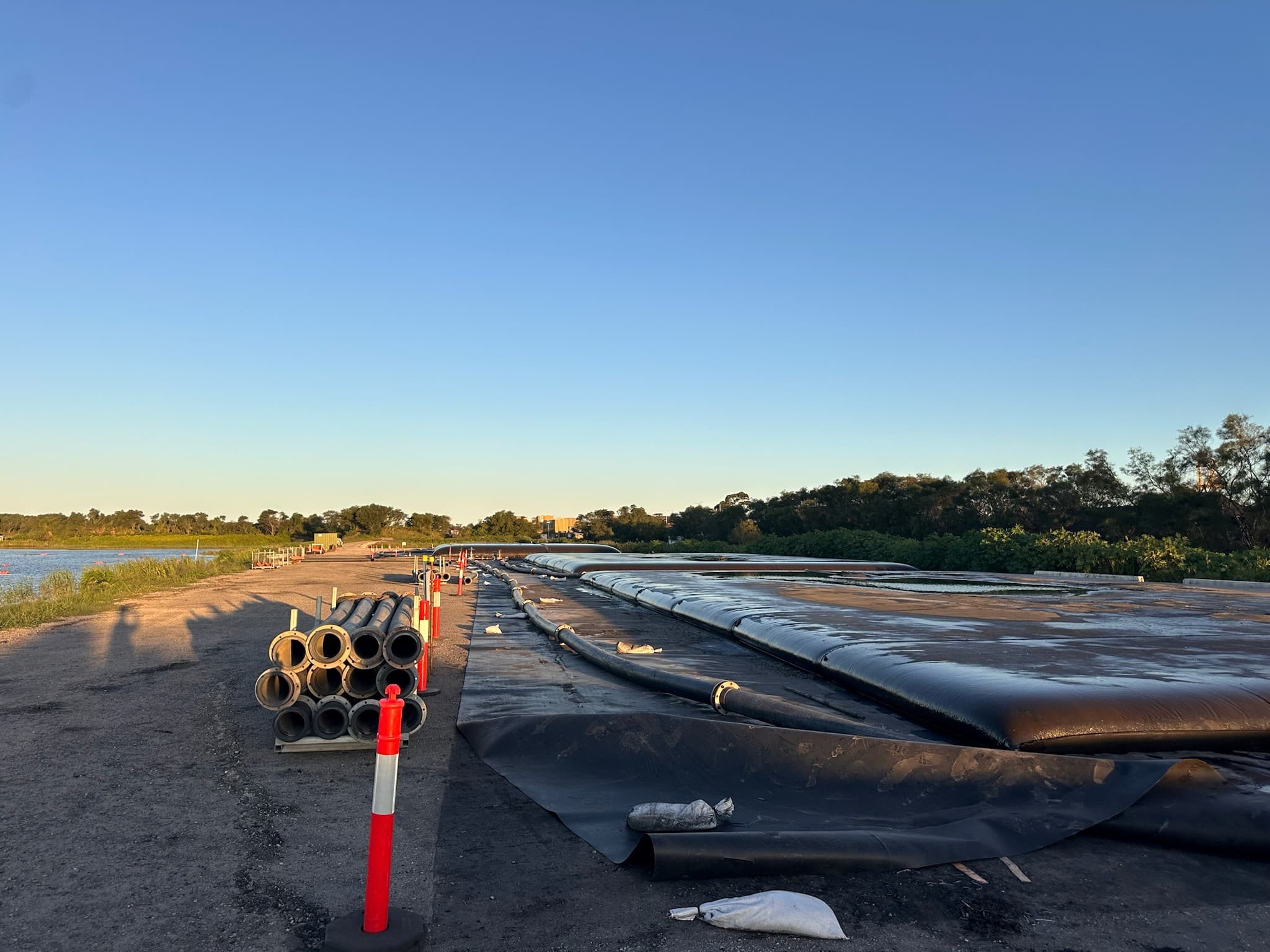 The laydown area was prepared for controlled drainage and proper containment of dewatered material.