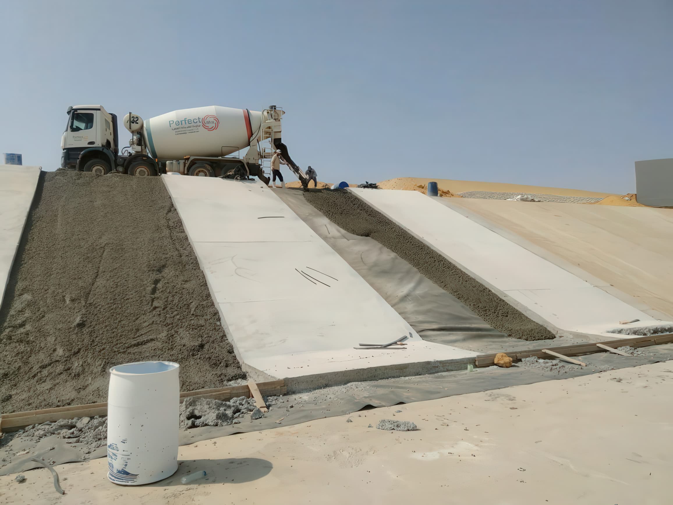 The geomembrane liners were installed beneath a concrete layer, creating a protected barrier that limits seepage and improves durability.