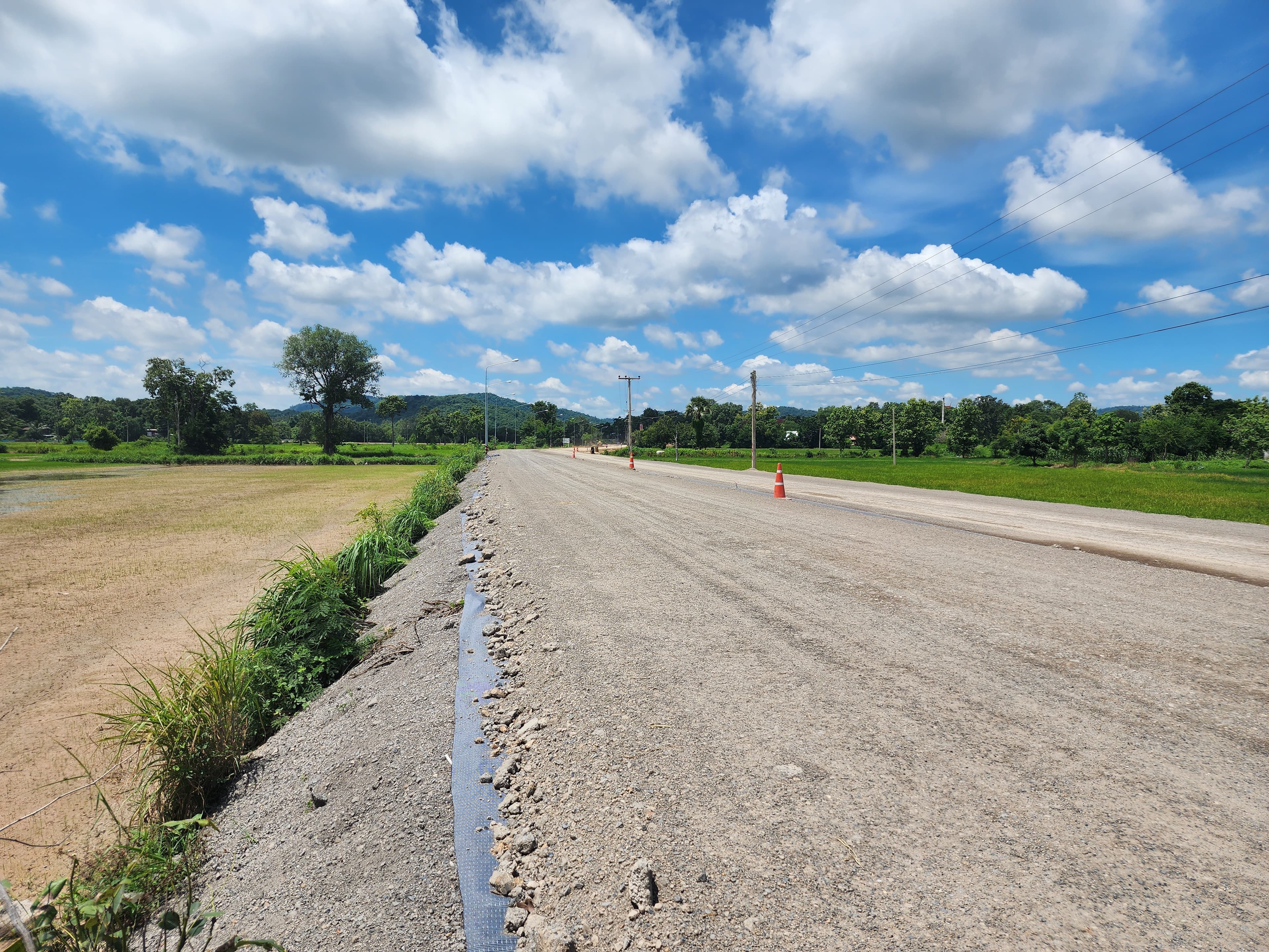 Side drains and cross-fall grading were cut at each phase to channel surface water away from the finished pavement
