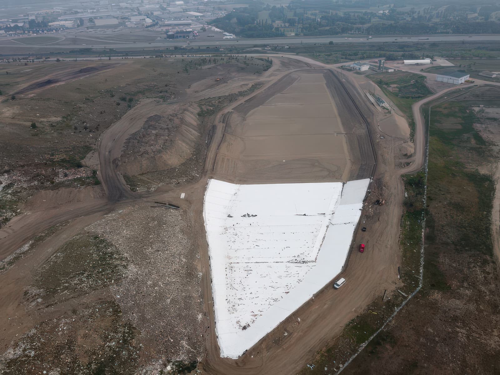 Wide aerial image of landfill, mid-installation