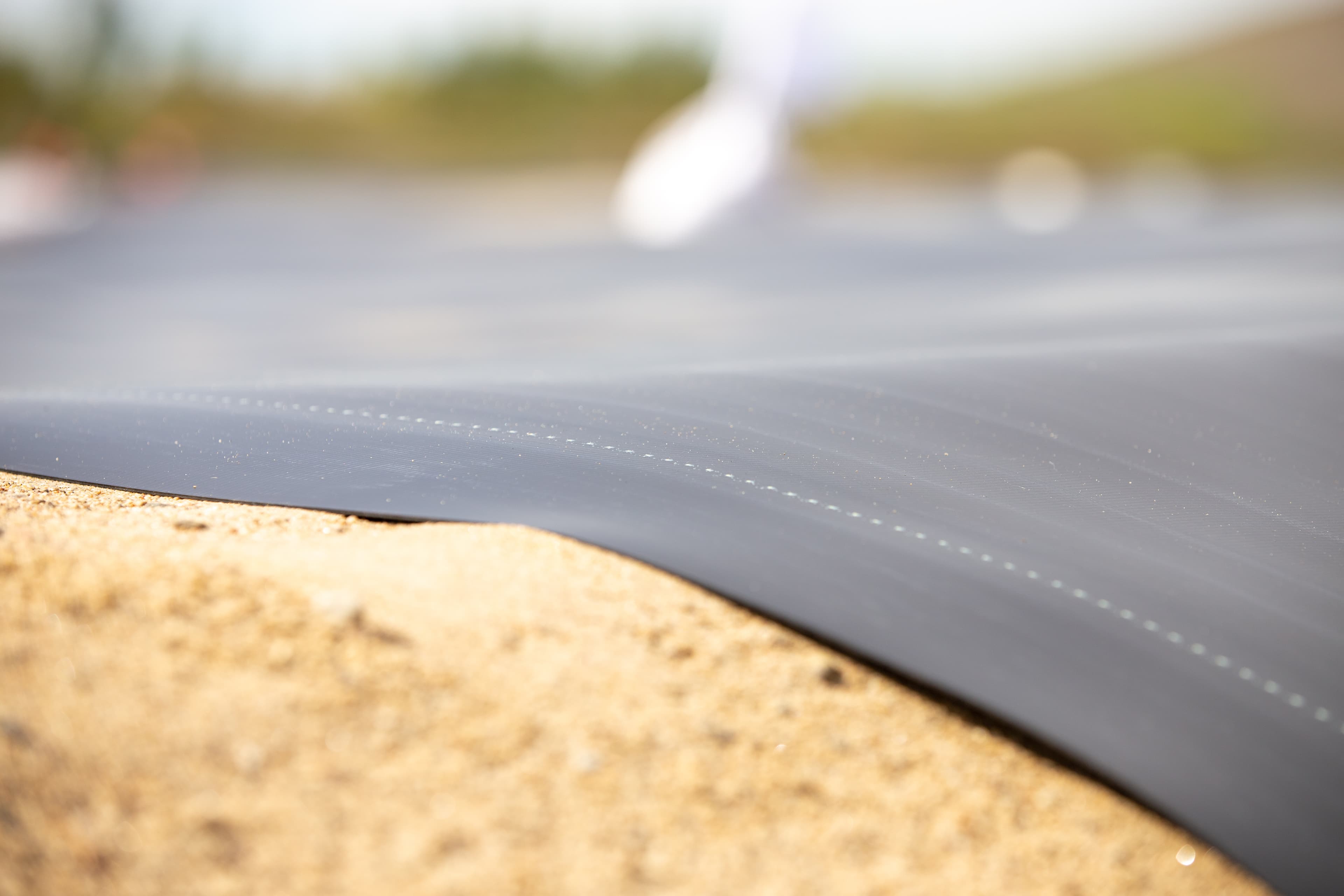 Layered geosynthetic system in progress, integrating FABRINET drainage and BENTOLINER GCL to meet long-term environmental and regulatory performance requirements.