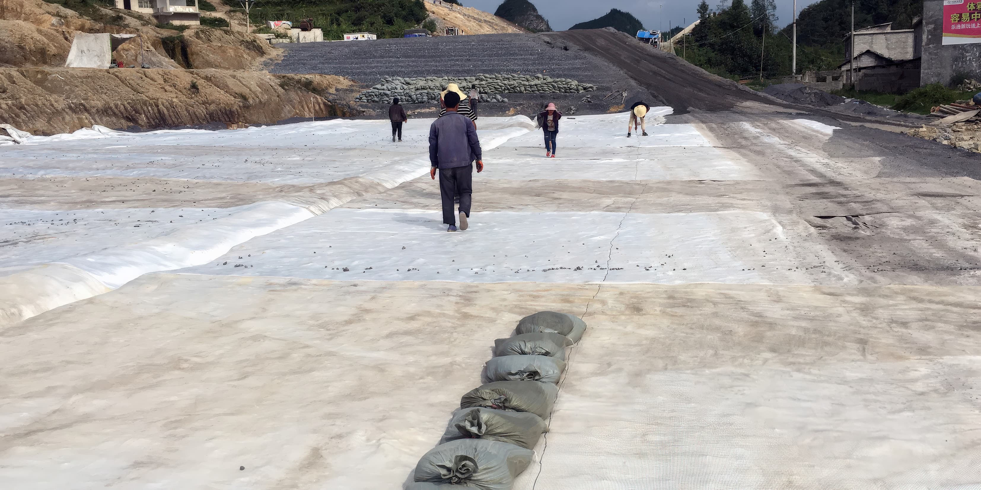 MIRAFI PET600 geotextile reinforcement installed at base of railway embankment