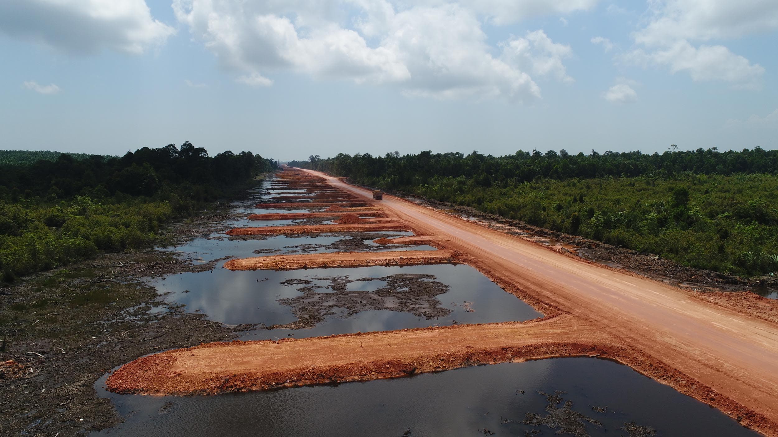 The access road plays a vital role in reducing transportation distance and time. To create the road network, a series of basal reinforced embankments were designed based on the existing ground terrain.